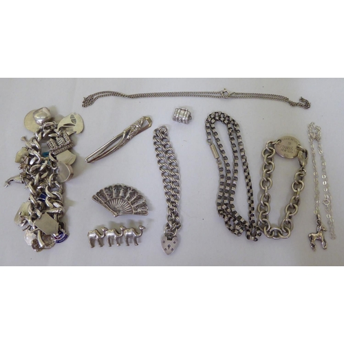 293 - Silver and white metal items of personal ornament: to include pendant charms  mixed marks