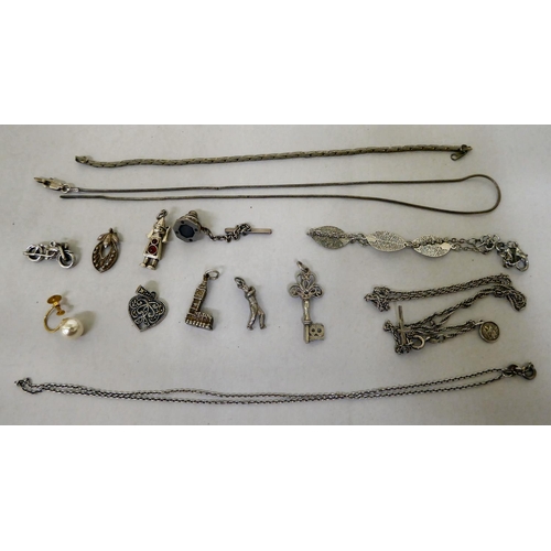 293 - Silver and white metal items of personal ornament: to include pendant charms  mixed marks