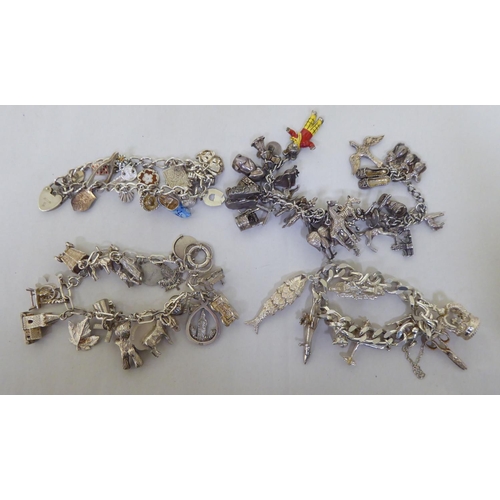 294 - Silver and white metal items of personal ornament: to include pendant charms  mixed marks