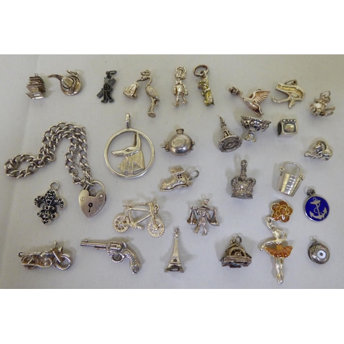 294 - Silver and white metal items of personal ornament: to include pendant charms  mixed marks