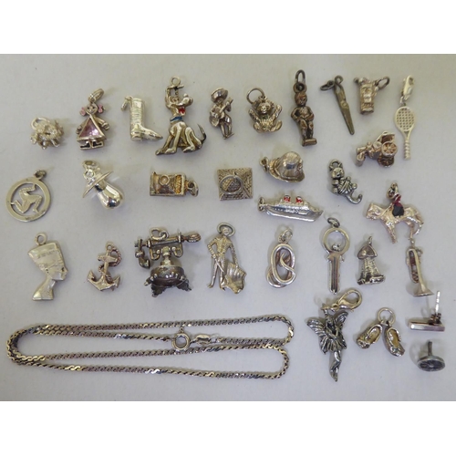 294 - Silver and white metal items of personal ornament: to include pendant charms  mixed marks