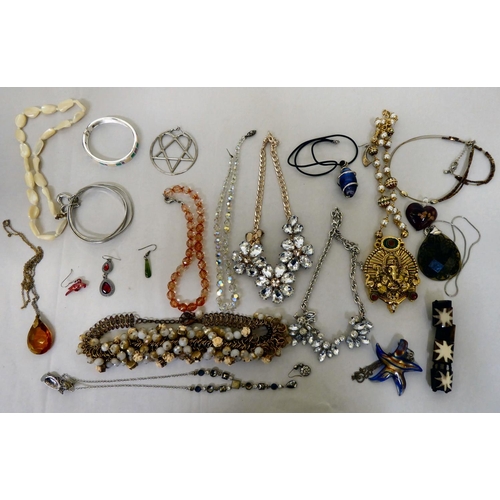 316 - Costume jewellery: to include an Indian white metal brooch, decorated with a goddess