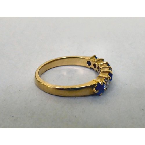 335 - An 18ct gold diamond and sapphire half-eternity ring