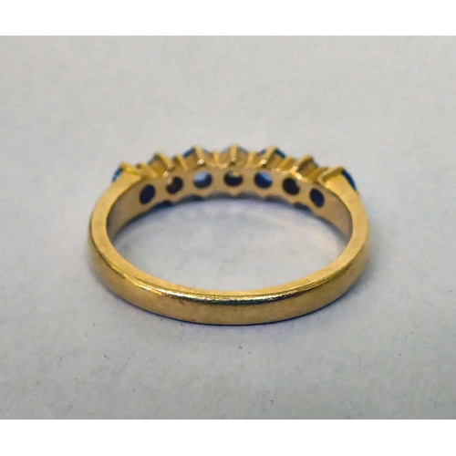 335 - An 18ct gold diamond and sapphire half-eternity ring