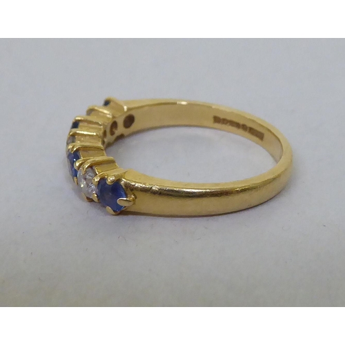 335 - An 18ct gold diamond and sapphire half-eternity ring