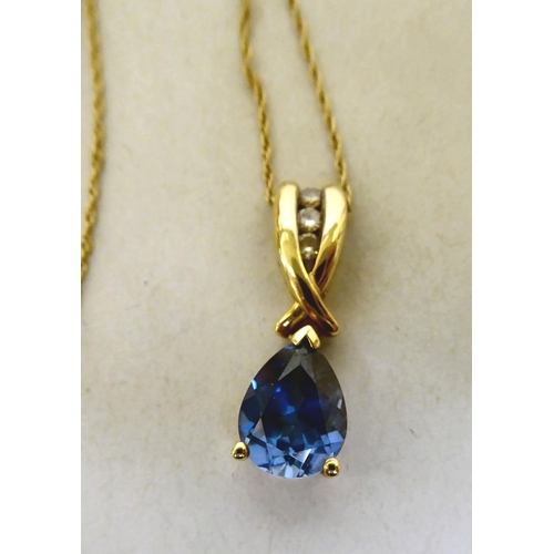 336 - A 9ct gold blue tanzanite and diamond pendant necklace