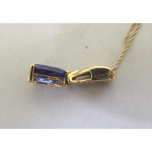 336 - A 9ct gold blue tanzanite and diamond pendant necklace