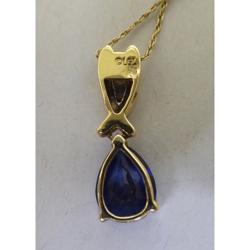 336 - A 9ct gold blue tanzanite and diamond pendant necklace