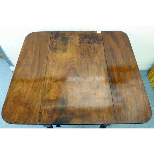 42 - A mid 19thC mahogany Pembroke table, raised on ring turned legs and casters  28