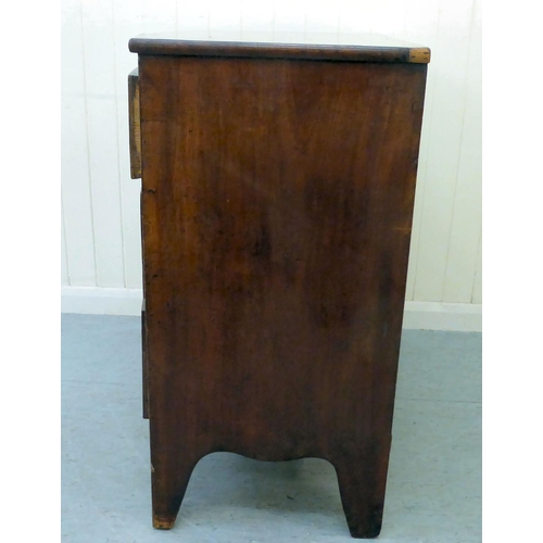 43 - A George III mahogany bow front, four drawer dressing chest, raised on bracket feet  34