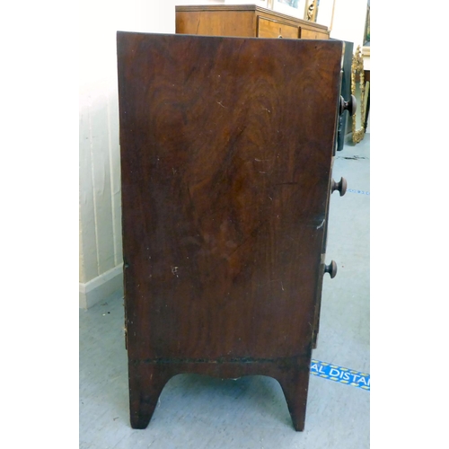 44 - An early Victorian mahogany bow front, three drawer dressing chest, raised on bracket feet  34