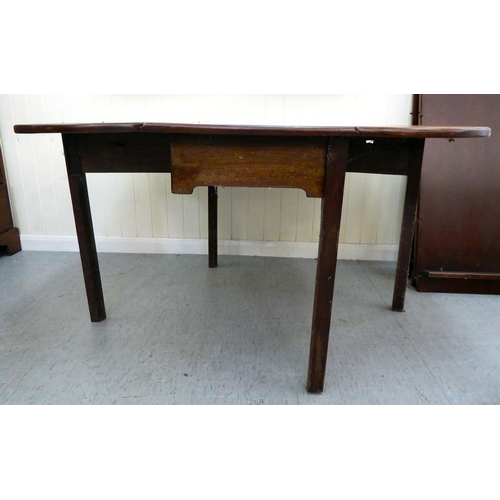 50 - A George III mahogany drop-leaf table, raised on square legs  28