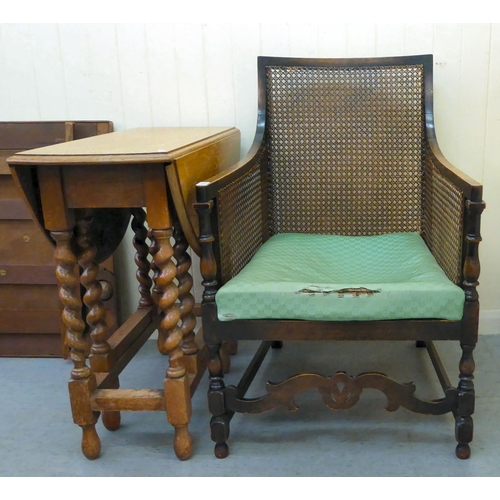 52 - Small furniture: to include an early 20thC mahogany showwood framed bergere chair, raised on turned ... 