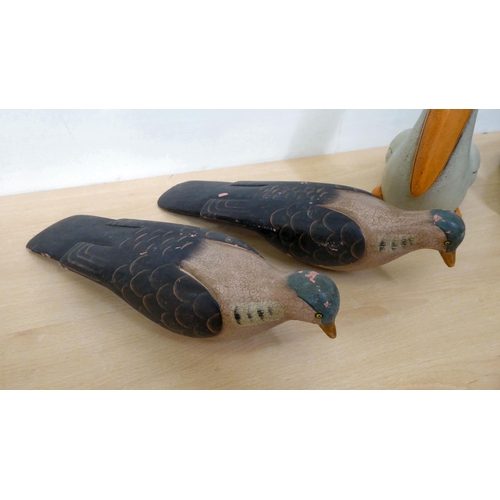 112 - Four variously carved and painted decorative birds, in the manner of decoys: to include a duck ... 