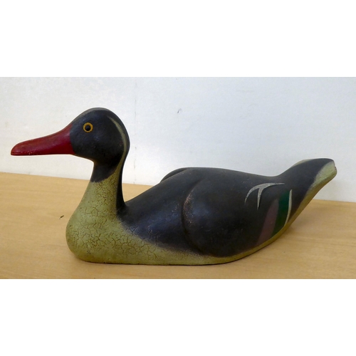 112 - Four variously carved and painted decorative birds, in the manner of decoys: to include a duck ... 