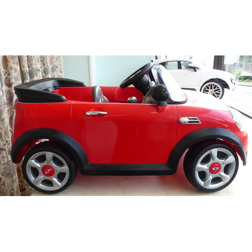 141 - A child's display model only, battery powered replica vehicle, fashioned as a Mini Convertible ... 