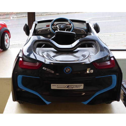 142 - A child's display model only, battery powered replica vehicle, fashioned as a BMW I8 Convertible&nbs... 