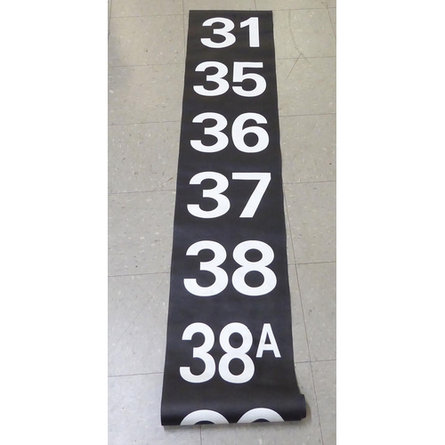 148 - Four printed paper, white on black bus route style rolls, featuring destinations and numbers