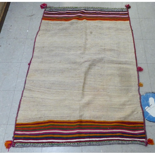 154 - A Kelim design rug, decorated with a cream ground, bordered by multi-coloured bands  40