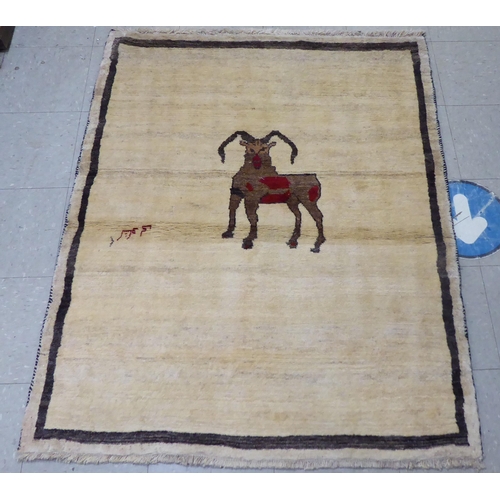 160 - A Persian Gabbeh design pictorial rug, depicting a ram and text  44