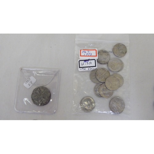 164 - Silver coins: to include a late Victorian shilling; and a bracelet