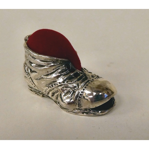 18 - A silver plated pin cushion, in the form of an old boot