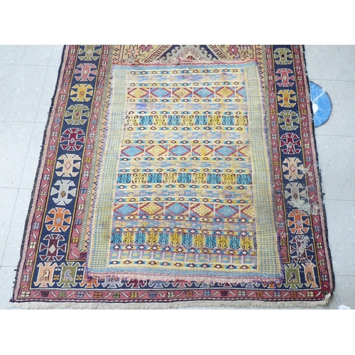 188 - A Kelim rug, decorated in geometric colours  23