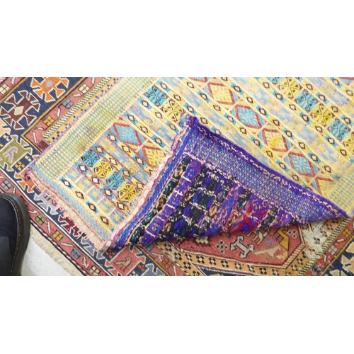 188 - A Kelim rug, decorated in geometric colours  23