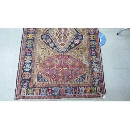 188 - A Kelim rug, decorated in geometric colours  23