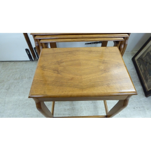 200 - A quartetto of modern teak occasional tables, raised on splayed legs  largest 21