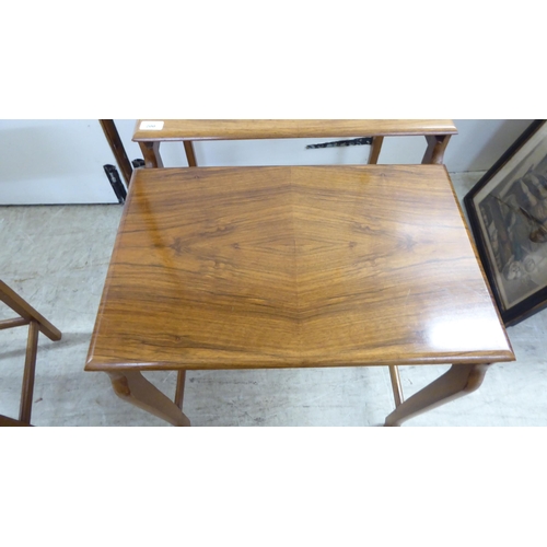 200 - A quartetto of modern teak occasional tables, raised on splayed legs  largest 21