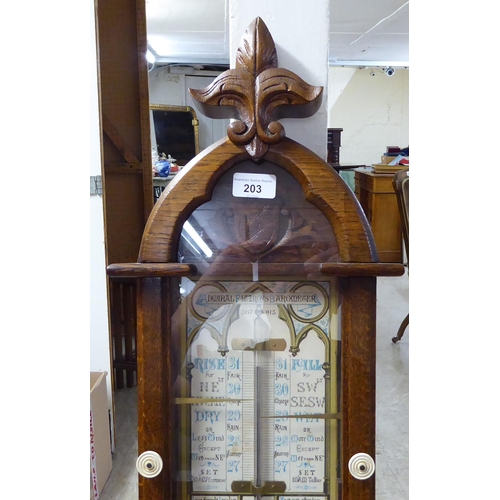 203 - An early 20thC Admiral Fitzroys barometer, in a glazed oak case  47