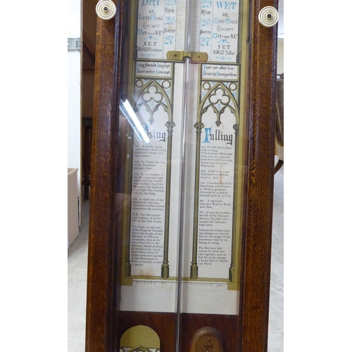 203 - An early 20thC Admiral Fitzroys barometer, in a glazed oak case  47