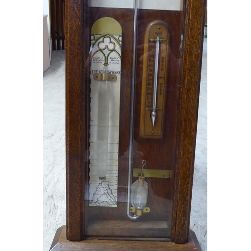 203 - An early 20thC Admiral Fitzroys barometer, in a glazed oak case  47