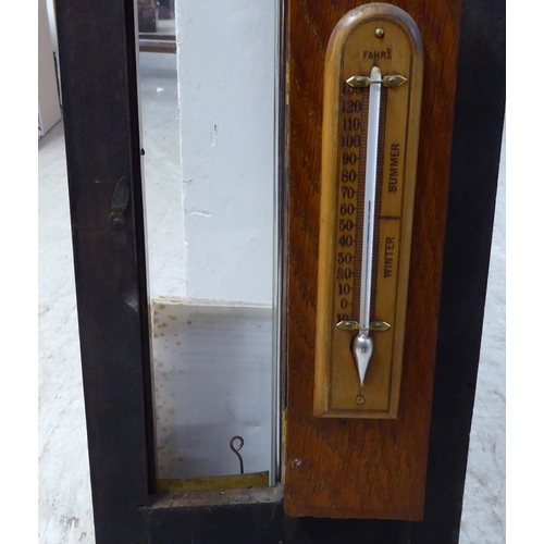 203 - An early 20thC Admiral Fitzroys barometer, in a glazed oak case  47