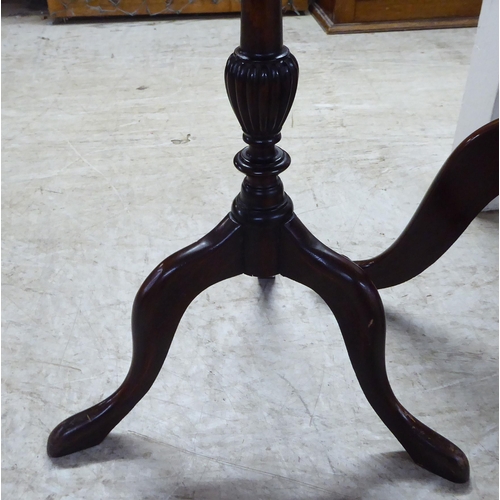 205 - Three dissimilar late 19th/early 20thC mahogany and oak pedestal tables, each raised on a tripod bas... 