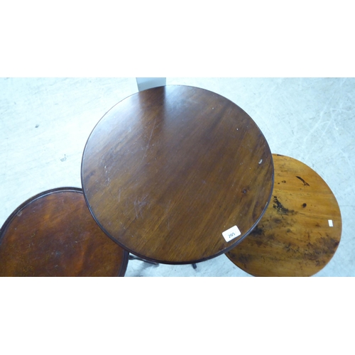 205 - Three dissimilar late 19th/early 20thC mahogany and oak pedestal tables, each raised on a tripod bas... 