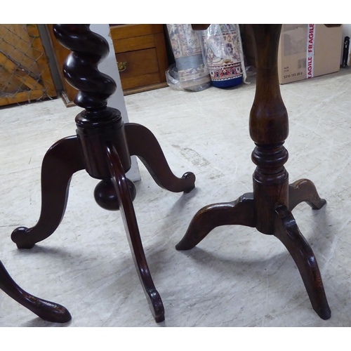 205 - Three dissimilar late 19th/early 20thC mahogany and oak pedestal tables, each raised on a tripod bas... 