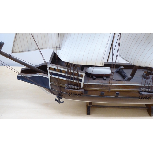 208 - A scratch built model sailing boat, on stand  32