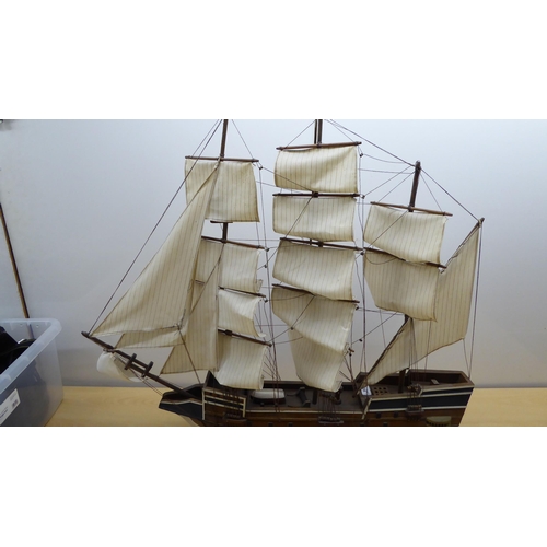 208 - A scratch built model sailing boat, on stand  32