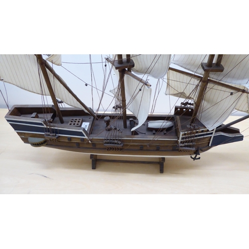 208 - A scratch built model sailing boat, on stand  32