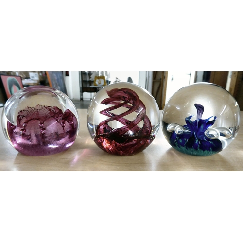 21 - Collectable glassware: to include individually, uniquely decorated paperweights with examples by Sel... 