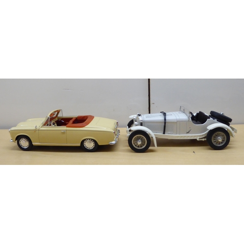 216 - Seven diecast and plastic model vehicles: to include a Solido 1/18 scale Peugeot 403 Cabriolet Grand... 