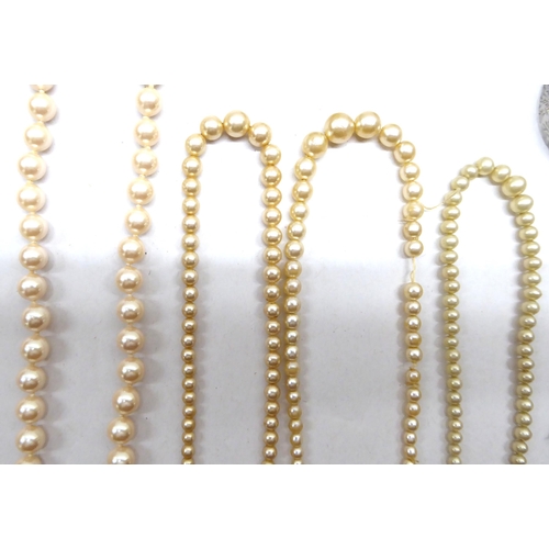 220 - Costume jewellery: to include two single strand, simulated pearl necklaces 