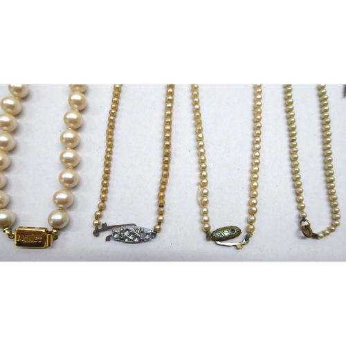 220 - Costume jewellery: to include two single strand, simulated pearl necklaces 