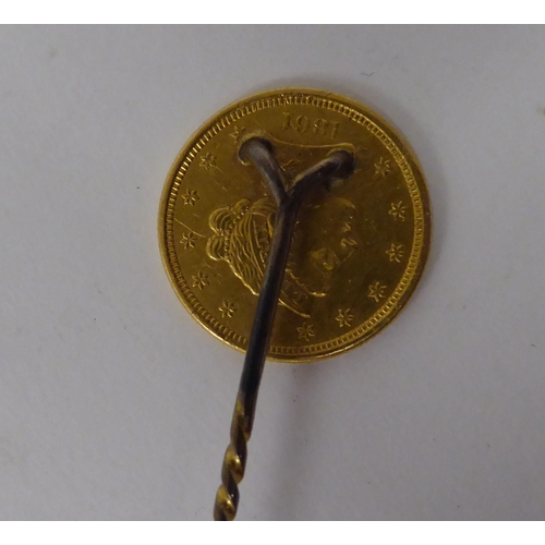 238 - A stick pin, set with a gold US 2.5 dollar coin  dated 1861