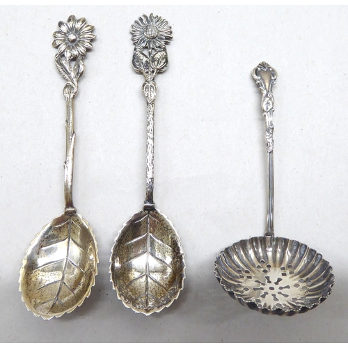 241 - Silver and white metal collectables: to include a late Victorian silver base and capped glass hip fl... 