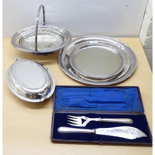 242 - Silver plate and glass tableware: to include decanters, serving items and a biscuit barrel 