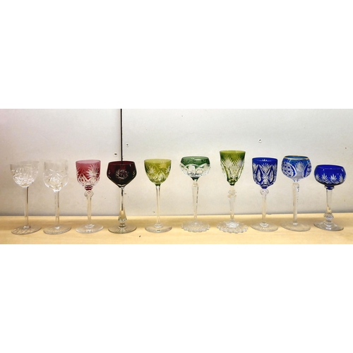 243 - A set of ten crystal hock glasses, each with a different style and coloured bowl, stem and base