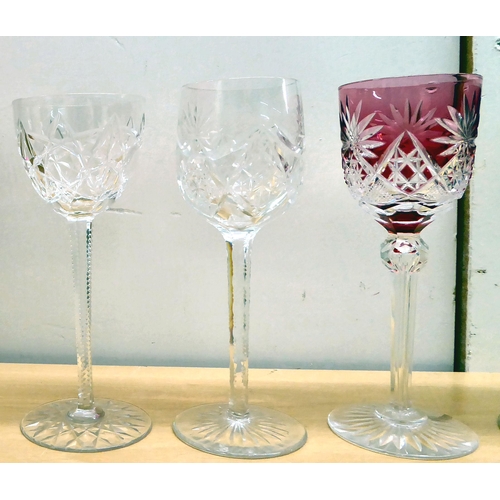 243 - A set of ten crystal hock glasses, each with a different style and coloured bowl, stem and base